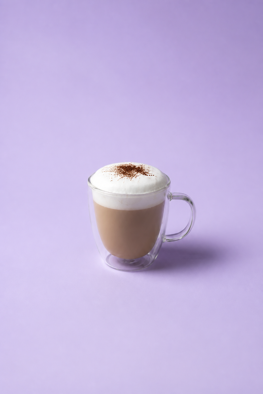 Cappuccino on a lavender studio background