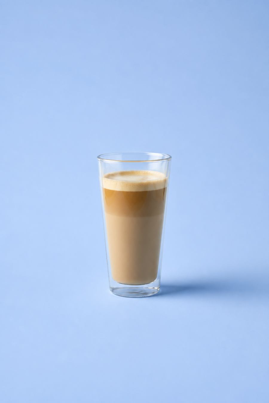 Latte on a powder-blue studio background